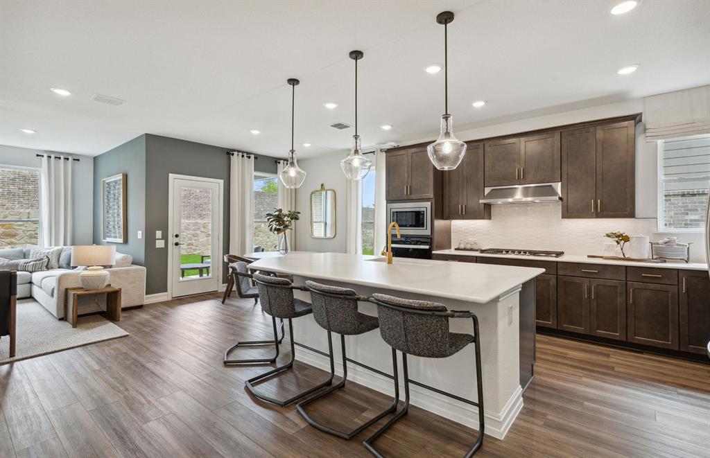 4708 Ripley Court Celina, TX 75009 - Photo 4 of 18 *Model Representation - Large island overlooking gathering room and dining areas