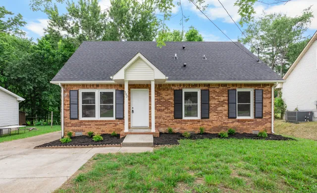 front view of a house with a yard