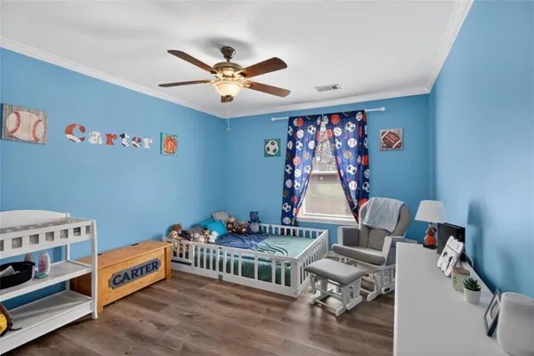 a bedroom with furniture and a window