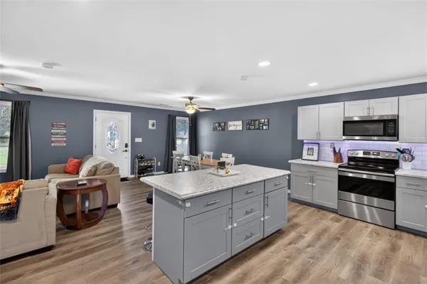 a kitchen with a sink stove and cabinets