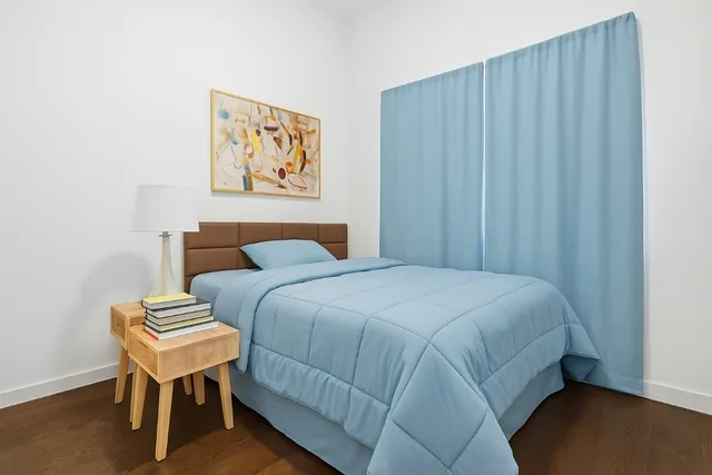 a bedroom with a bed and a couch