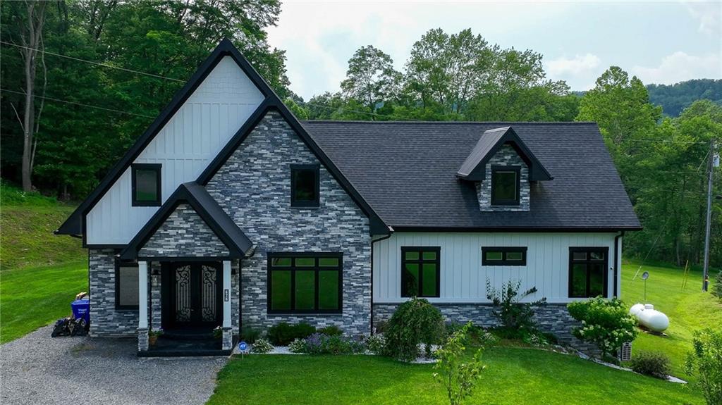 a view of a house with garden and yard