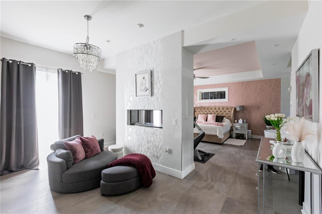 267 Reibold Road Renfrew, PA 16053 - Photo 13 of 39 a living room with furniture a chandelier and a window