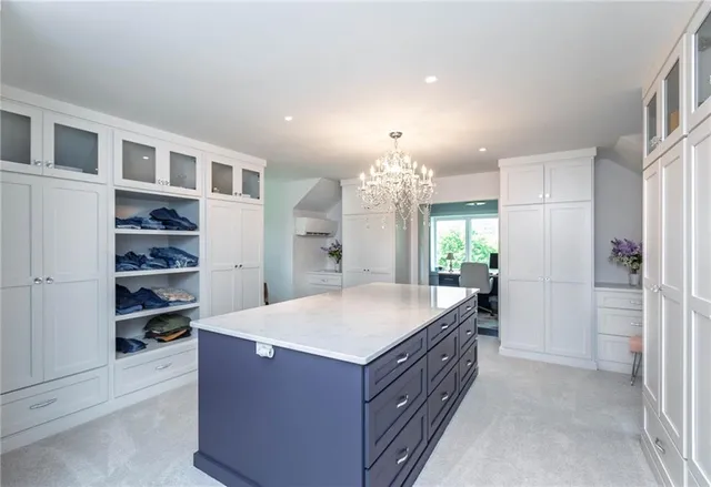 a kitchen with kitchen island cabinets and refrigerator