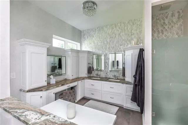 a kitchen with a sink cabinets and window