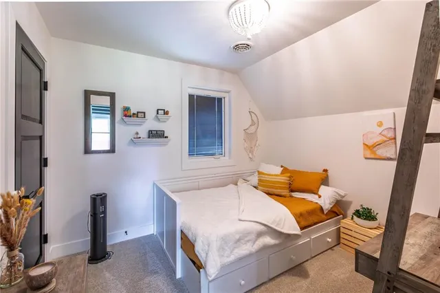 a bedroom with furniture and wooden floor