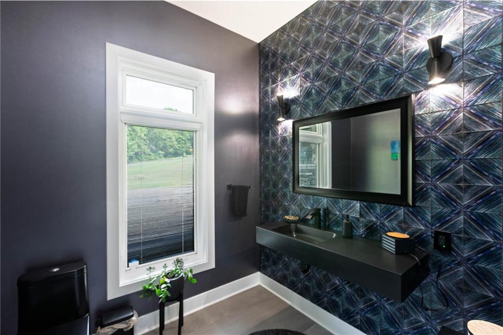 267 Reibold Road Renfrew, PA 16053 - Photo 21 of 39 a bathroom with a sink and a mirror