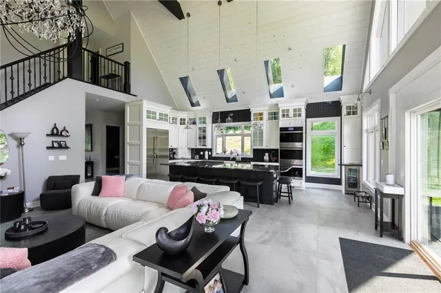 a living room with furniture fireplace and window