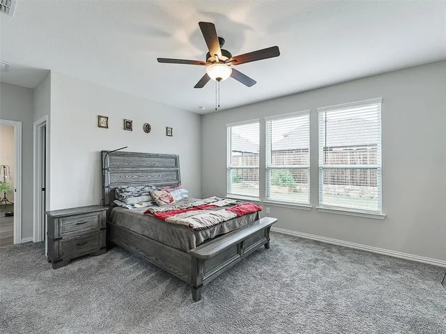 a bedroom with bed and window