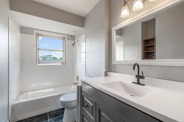 a bathroom with a sink a toilet and a bathtub