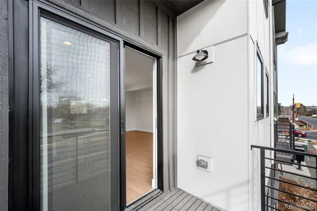 a bathroom with a glass shower door mirror and a shower