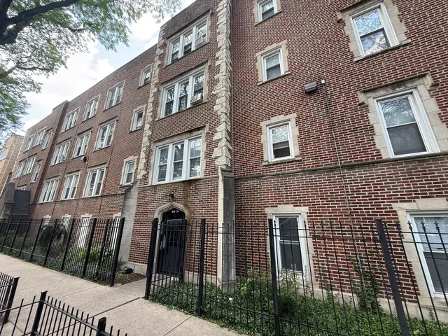 a front view of a building with glass windows