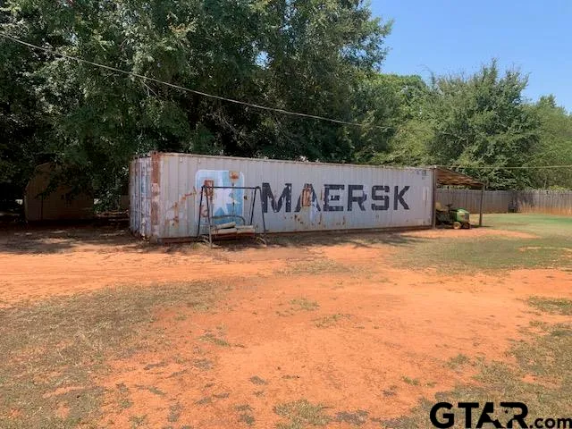 a view of outdoor space with wooden fence