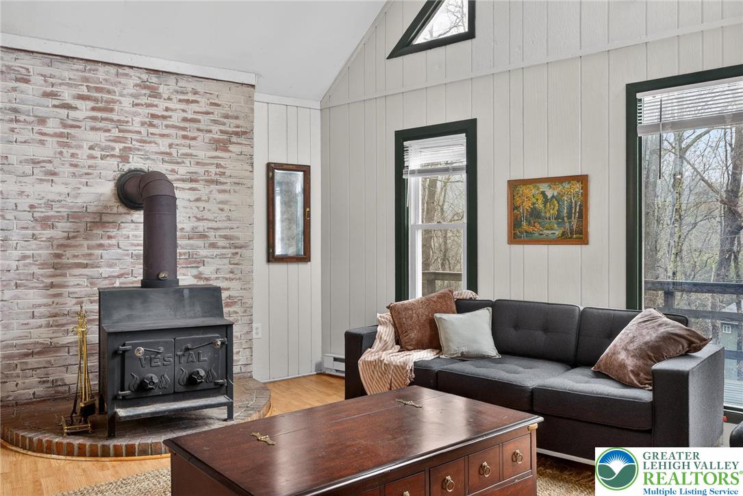 149 Regent Street Bushkill, PA 18324 - Photo 11 of 32 a living room with furniture and a fireplace