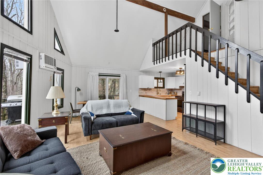 149 Regent Street Bushkill, PA 18324 - Photo 13 of 32 a living room with furniture a rug and a ceiling fan