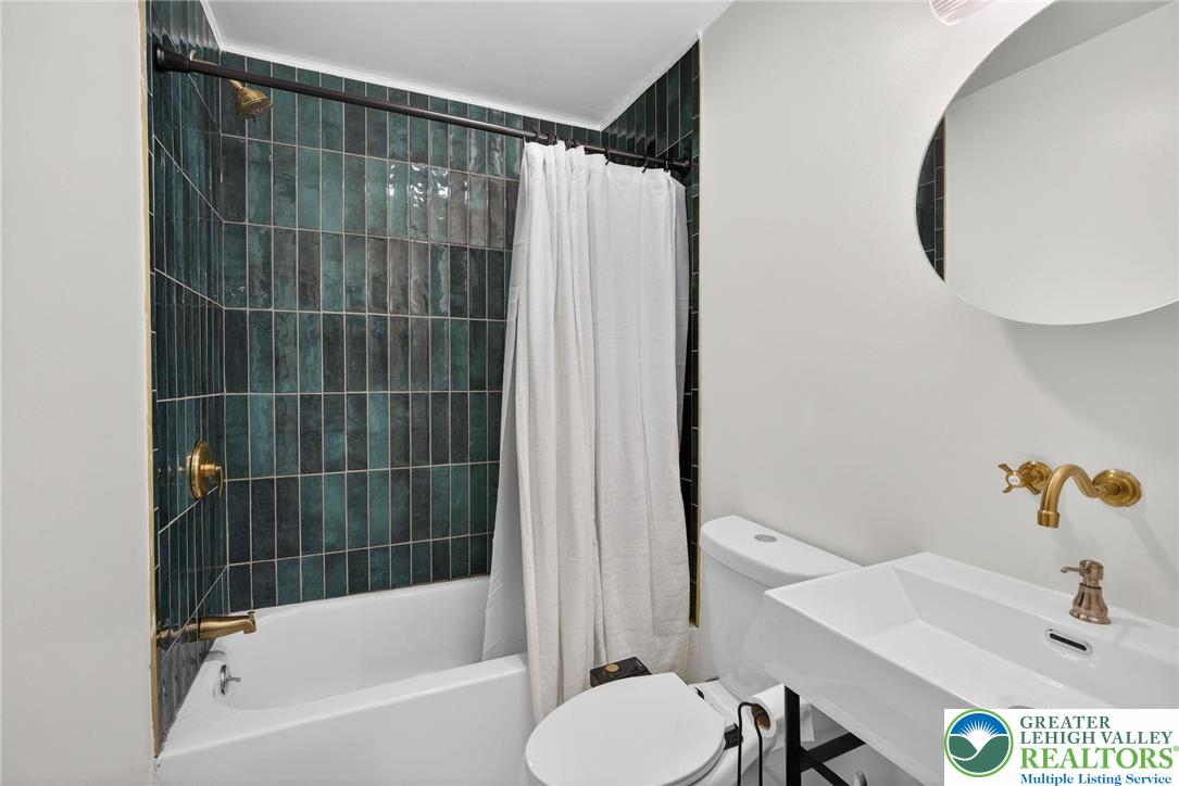 149 Regent Street Bushkill, PA 18324 - Photo 22 of 32 a bathroom with a shower and a sink