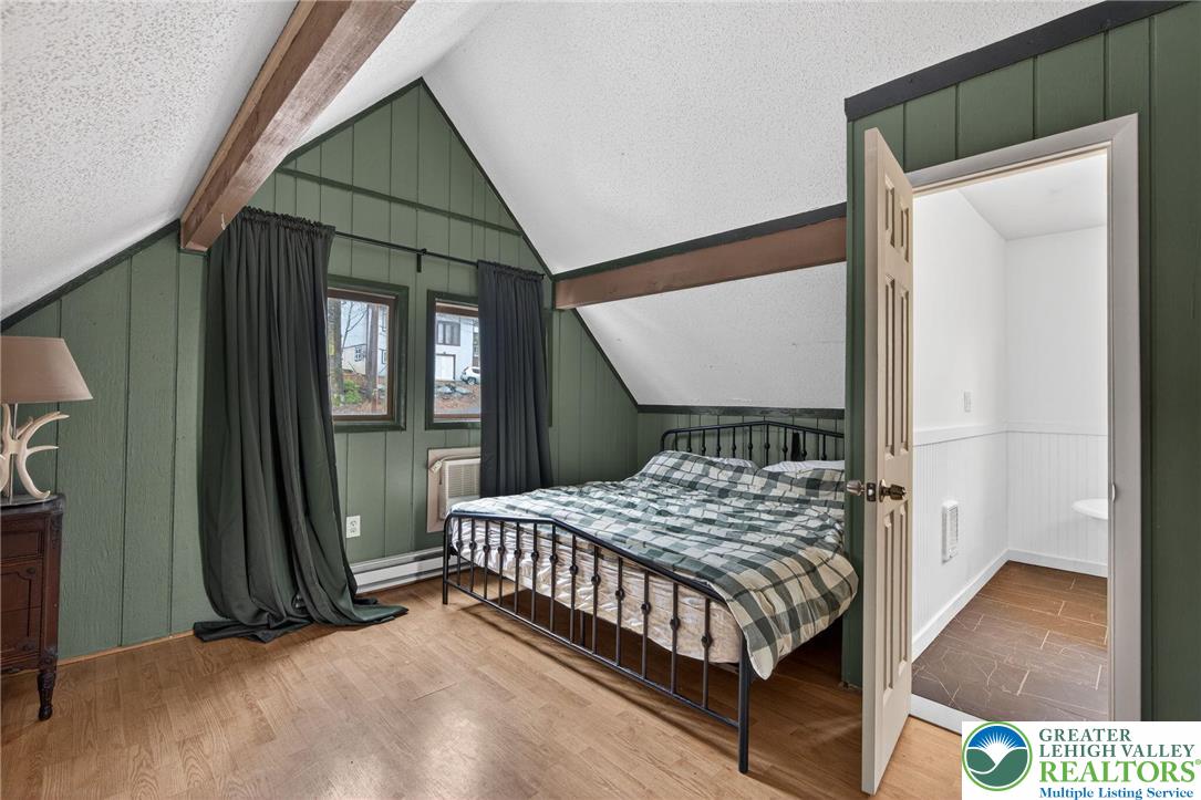 149 Regent Street Bushkill, PA 18324 - Photo 26 of 32 a bedroom with a bed next to a window