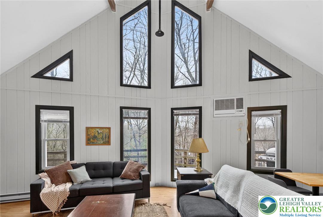149 Regent Street Bushkill, PA 18324 - Photo 9 of 32 a living room with furniture and paintings on the wall