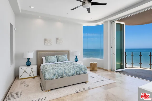 a bedroom with a bed and a walk in closet