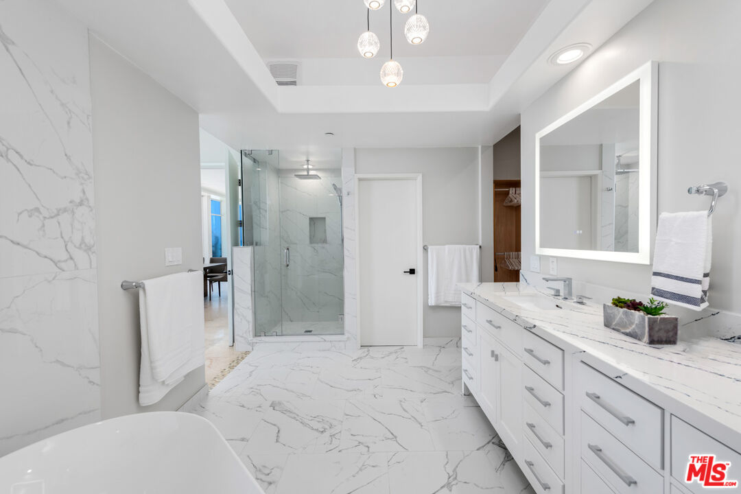 43250 Pacific Coast Highway Malibu, CA 90265 - Photo 15 of 21 a spacious bathroom with a double vanity sink toilet mirror and shower