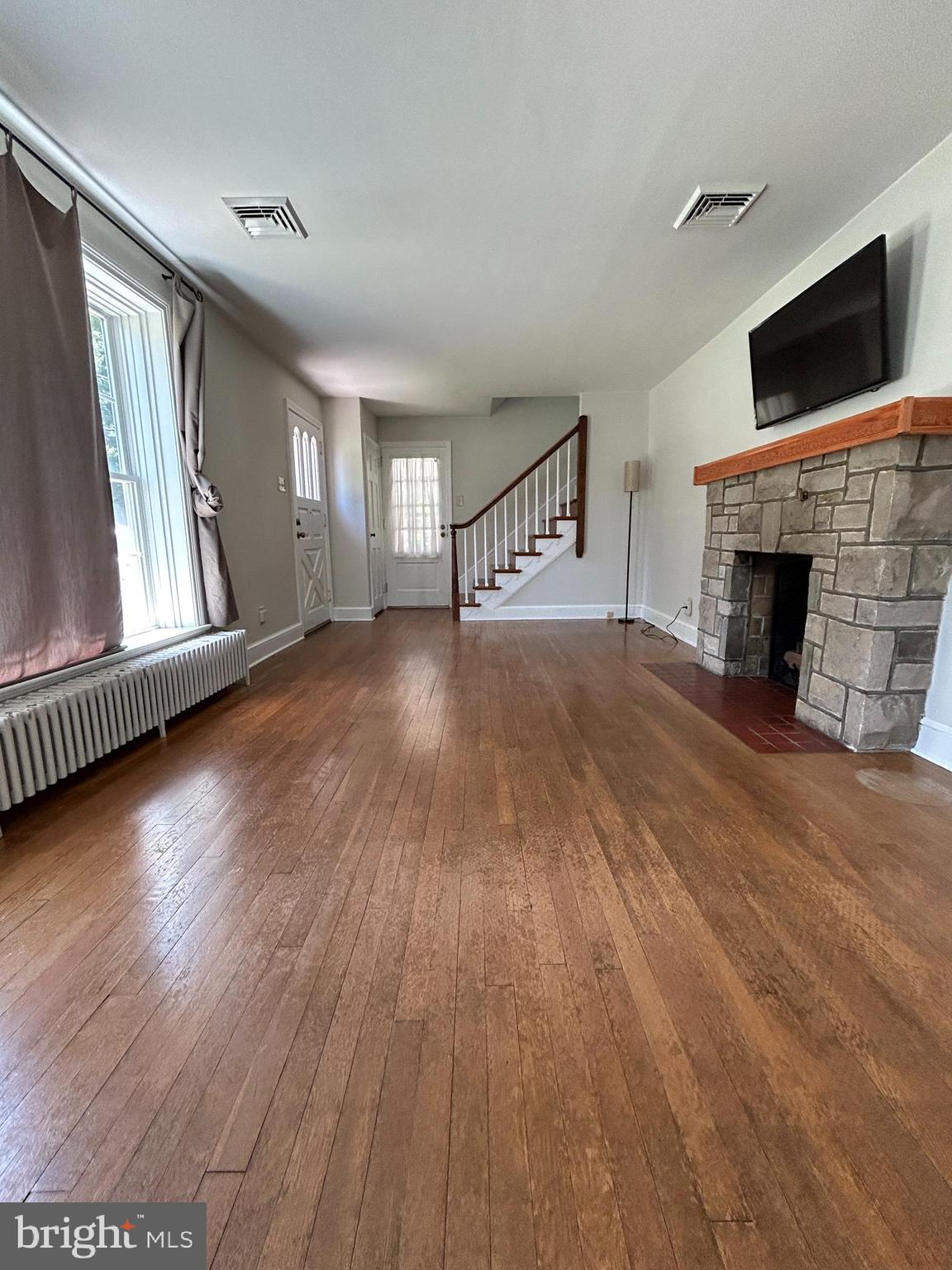 51 Homeland Road York, PA 17403 - Photo 4 of 45 wooden floor fireplace and windows in an empty room