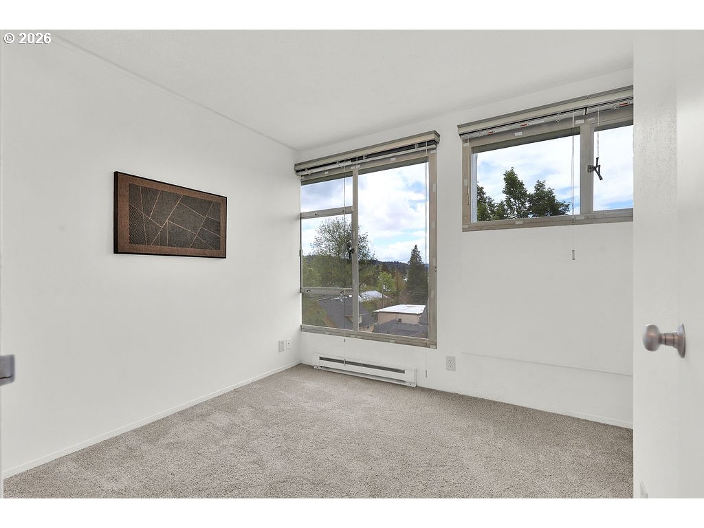 1313 Lincoln Street, Unit 508 Eugene, OR 97401 - Photo 15 of 22 a view of empty room with floor to ceiling window
