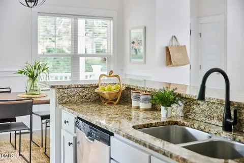 a kitchen with a sink and a window
