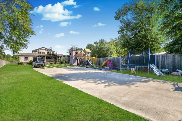 a living room with furniture a wooden floor and next to a window
