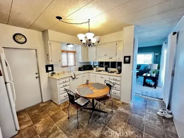 a view of a kitchen and dining table