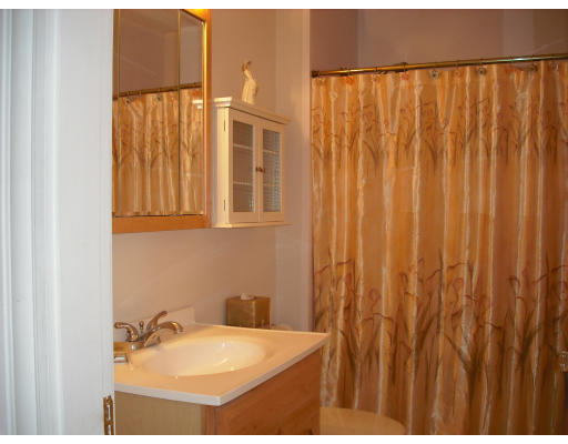 27-29 Topsfield Road, Unit 3 Ipswich, MA 01938 - Photo 13 of 16 a bathroom with a sink and a mirror