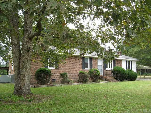 The exterior has great mature hardwood trees including Bradford pears that line the drive. Exterior Front
