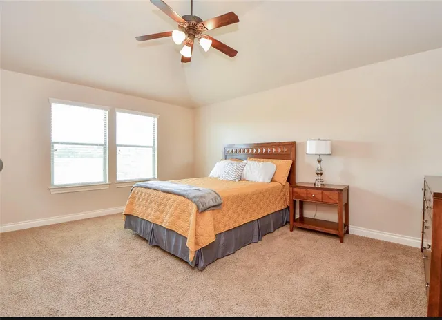 a white toilet sitting next to a white tub