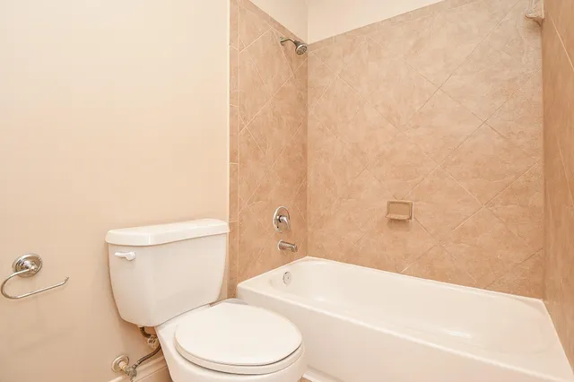 a view of a patio with a table and chairs
