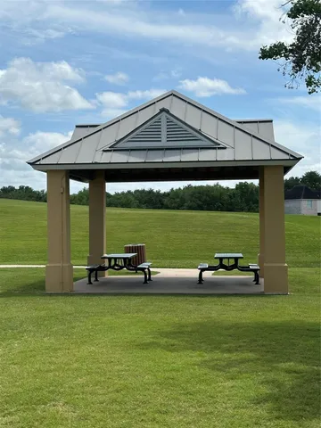 a view of a large trees with a yard