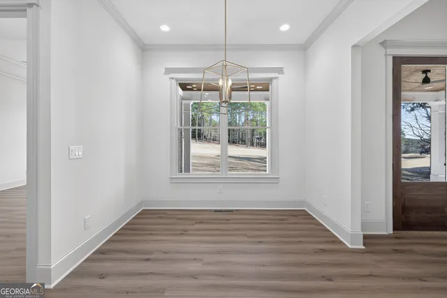 a view of an empty room with windows