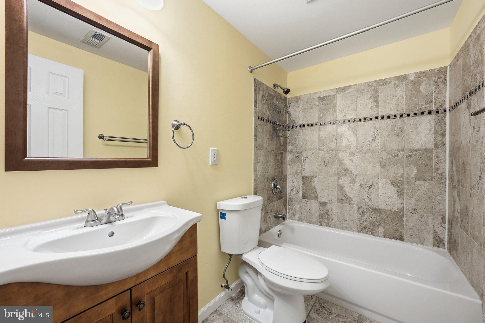 3679 Expedition Drive Triangle, VA 22172 - Photo 52 of 65 a bathroom with a sink toilet and shower
