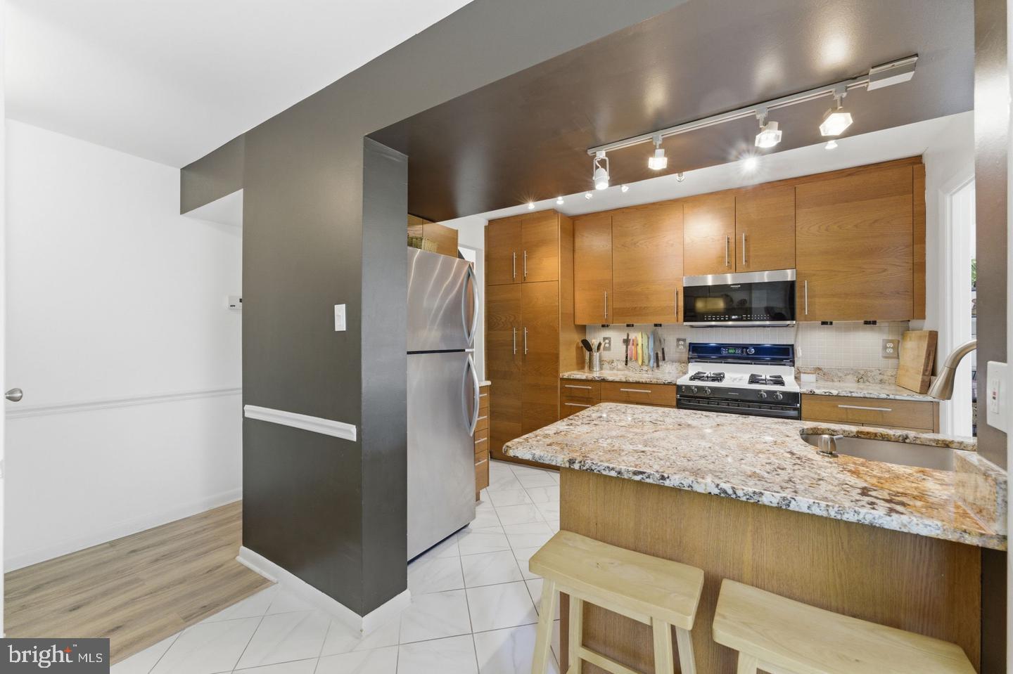 11260 Chestnut Grove Square, Unit 337 Reston, VA 20190 - Photo 26 of 82 Modern kitchen with sleek finishes.
