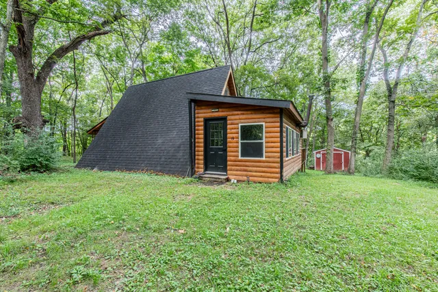 a backyard of a house with lots of green space