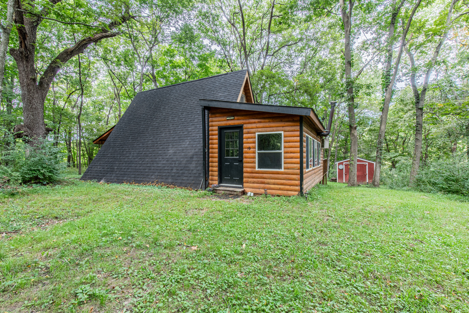 a backyard of a house with lots of green space
