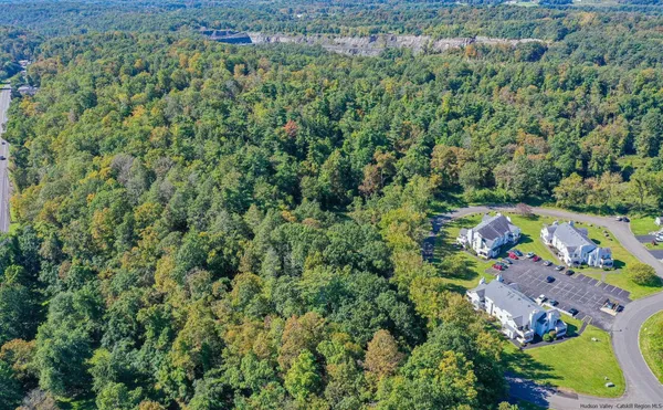 an aerial view of a houses with a yard