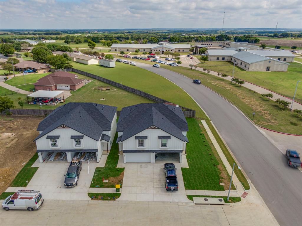 912 Cooksey Court, Unit A Grandview, TX 76050 - Photo 11 of 30 an aerial view of multiple houses with a yard