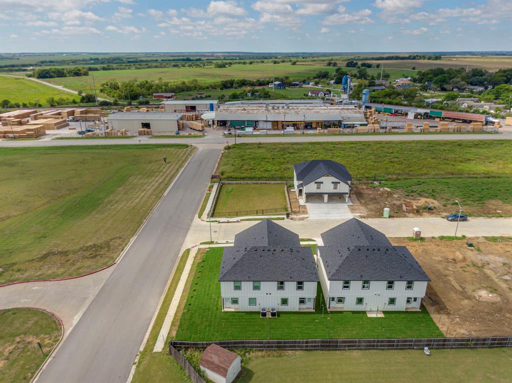 912 Cooksey Court, Unit A Grandview, TX 76050 - Photo 13 of 30 an aerial view of a house with a garden and lake view