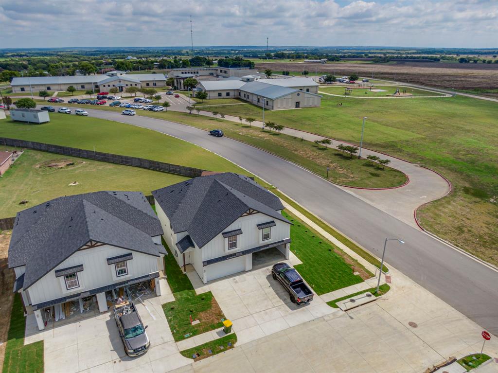 912 Cooksey Court, Unit A Grandview, TX 76050 - Photo 10 of 30 an aerial view of a house with a garden and lake view