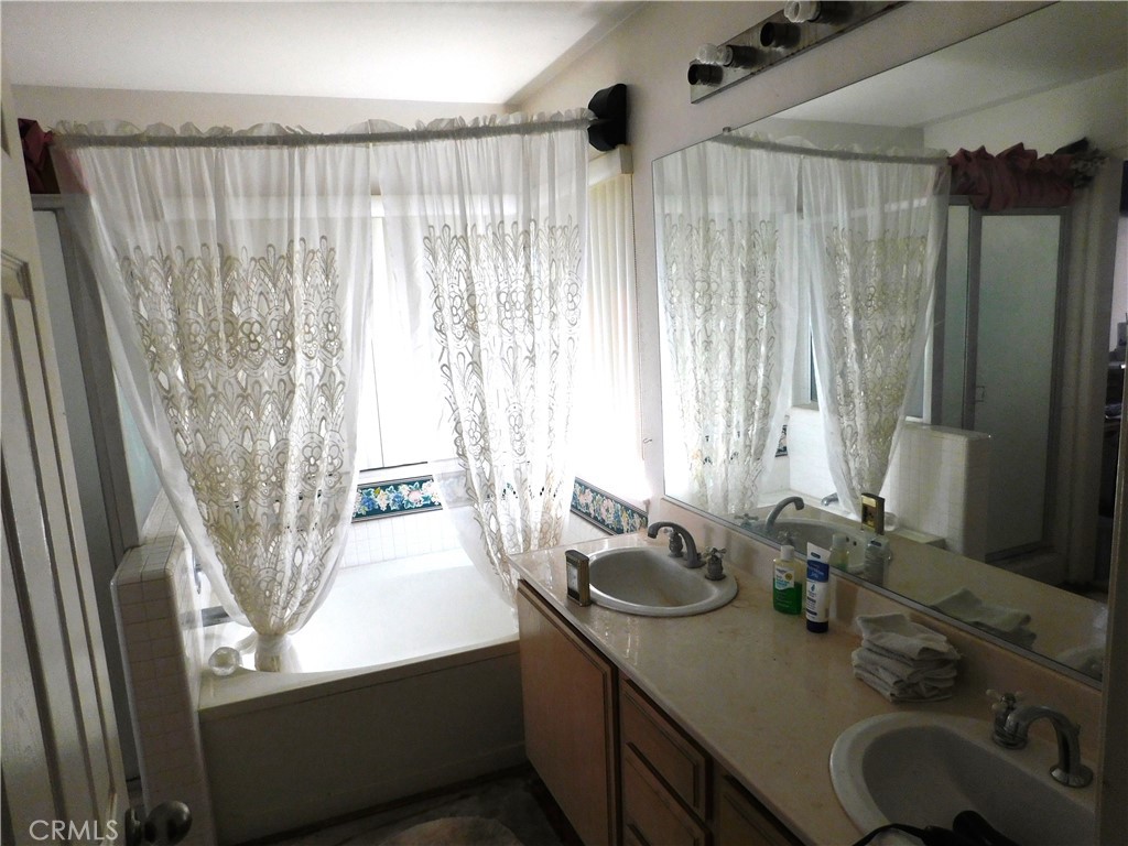 2368 Bayberry Way Hemet, CA 92545 - Photo 11 of 13 a bathroom with a sink and a mirror