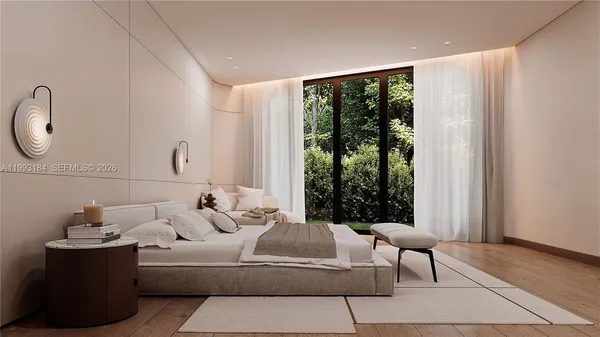 a bedroom with bed and glass door