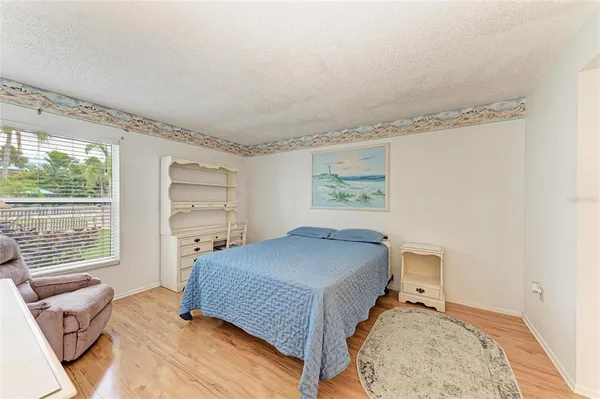 a bedroom with a bed and furniture