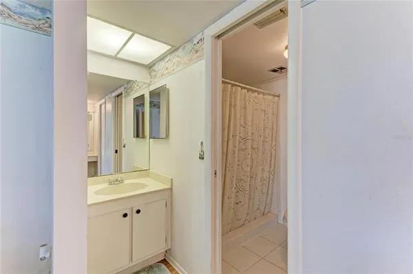 a bathroom with a shower and a toilet