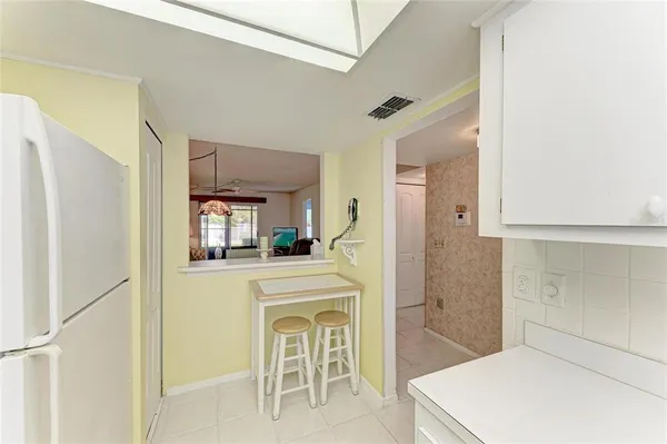 a bedroom with furniture and a lamp