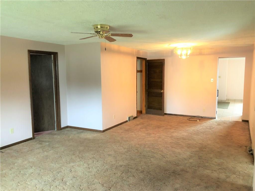 339 Bethel Road North Huntingdon, PA 15642 - Photo 17 of 25 FAMILY ROOM AT BACK OF THE HOME. TO THE LEFT IS THE SECOND BEDROOM LOOKING TO THE OPEN DOOR IS THE DINING ROOM