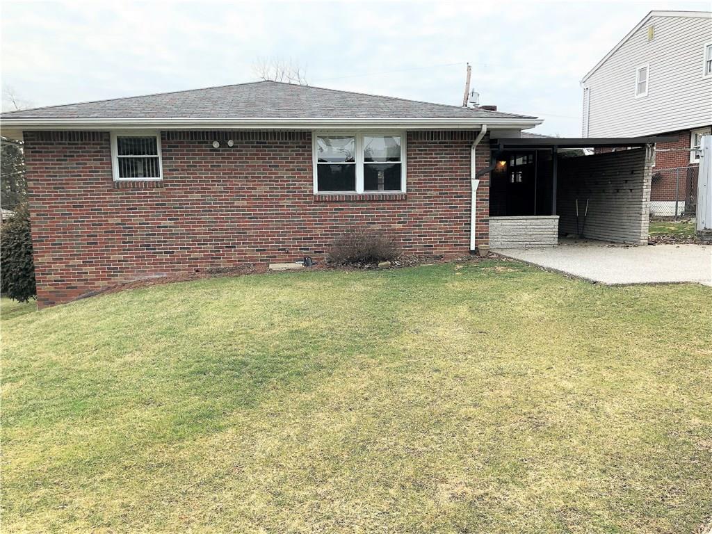339 Bethel Road North Huntingdon, PA 15642 - Photo 21 of 25 REAR OF THE HOME, CEMENT COVERED PATIO ON RIGHT